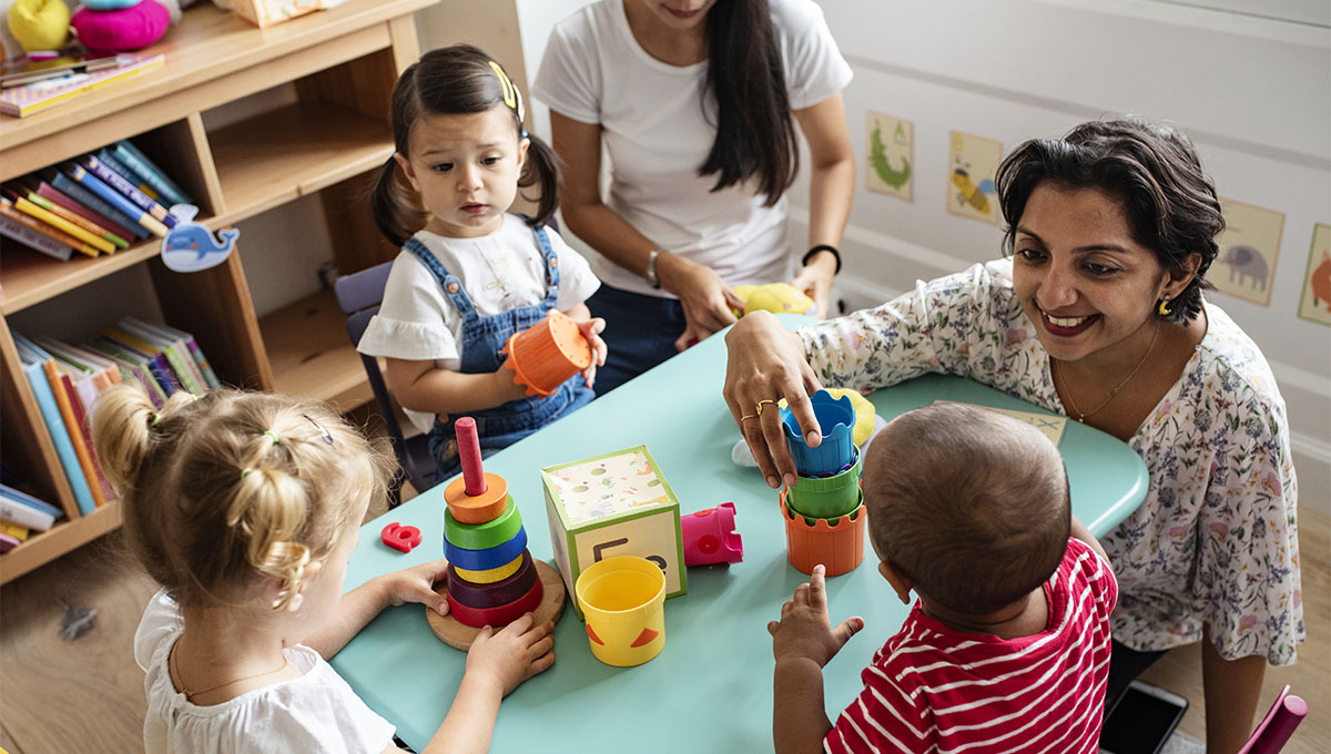 Children playing with teacher