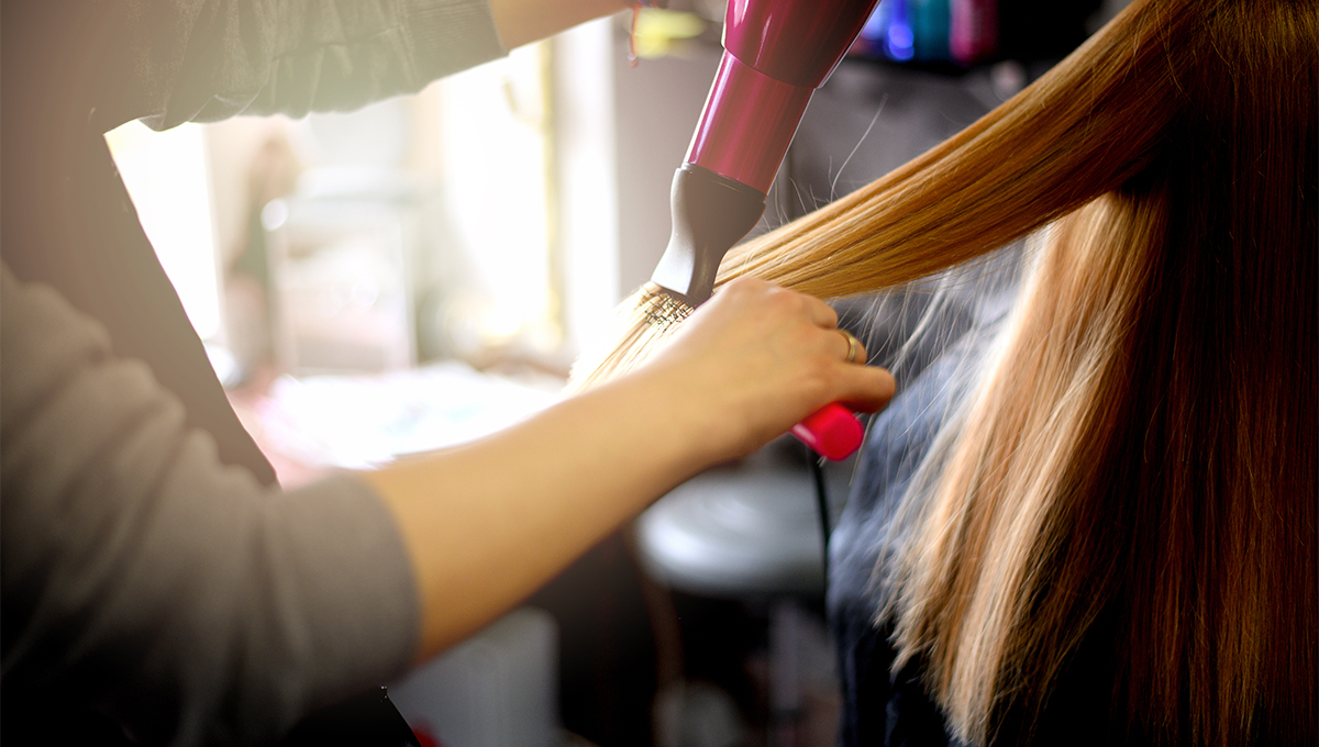 Hairdresser doing someone's hair