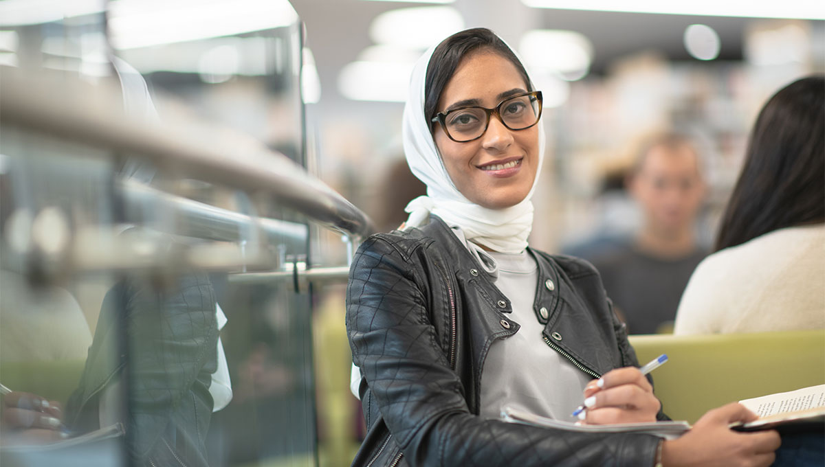 Student smiling and studying