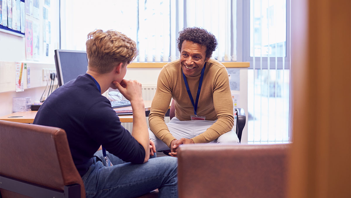 student and counselor talking