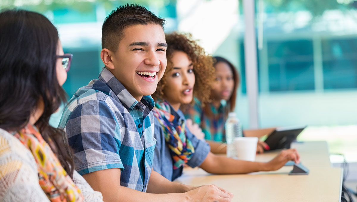 Student laughing with classmates