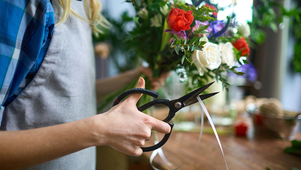 Hand cutting a ribbon